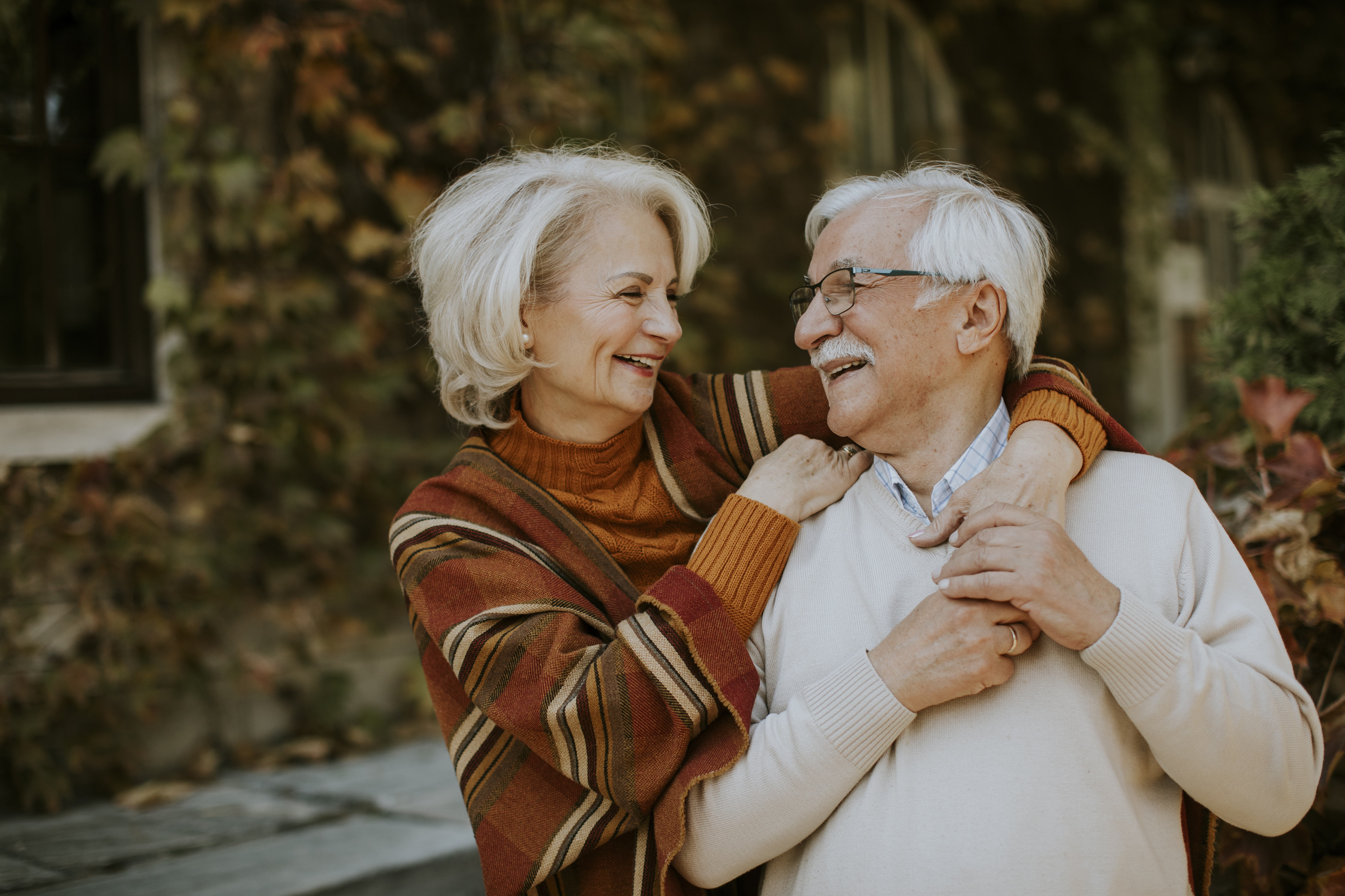 senior couple embracing and smiling
