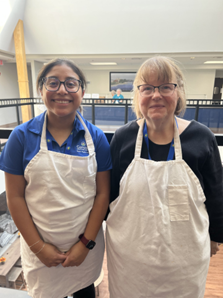 Genesis employees volunteering at Muskingum county center for seniors to serve meals