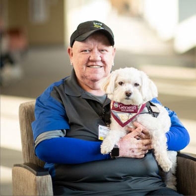 Genesis therapy dog, Rudy, Havanese breed, with owner Ellen Kader