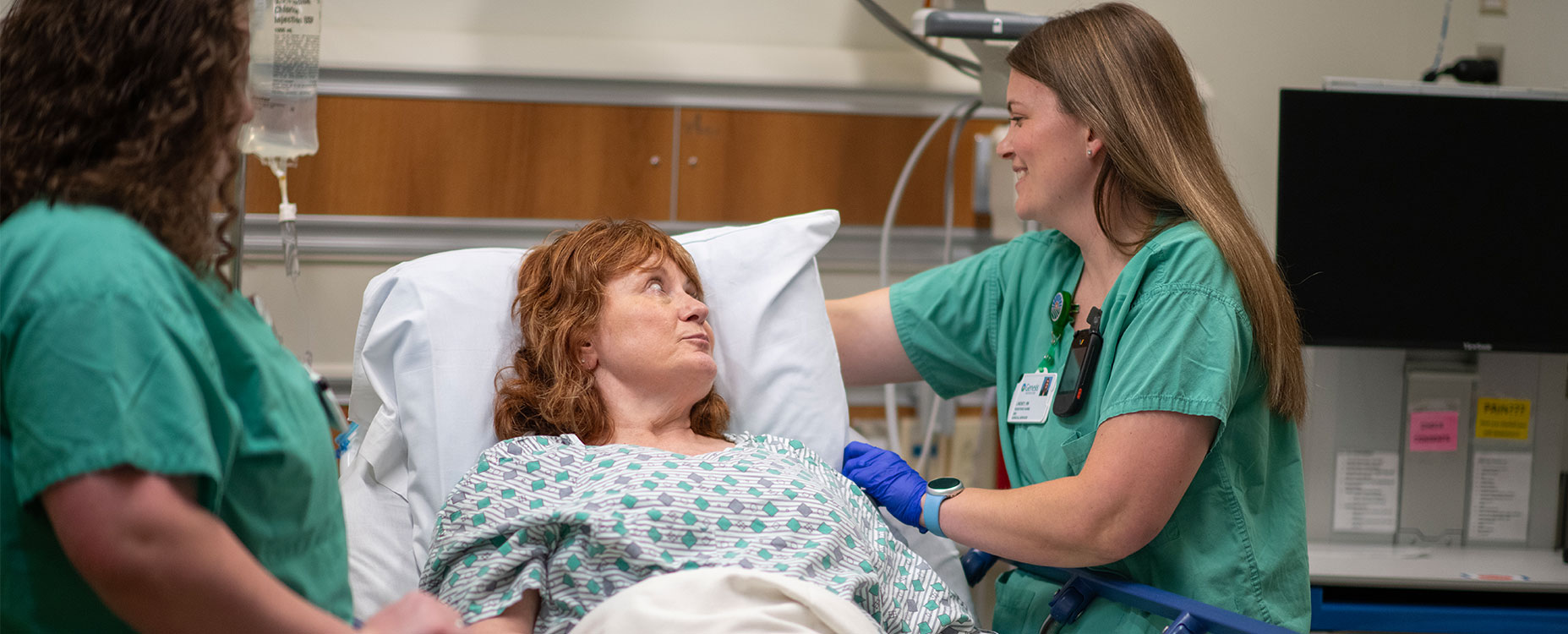 Healthcare Services page banner shows two Genesis healthcare providers taking care of a patient 