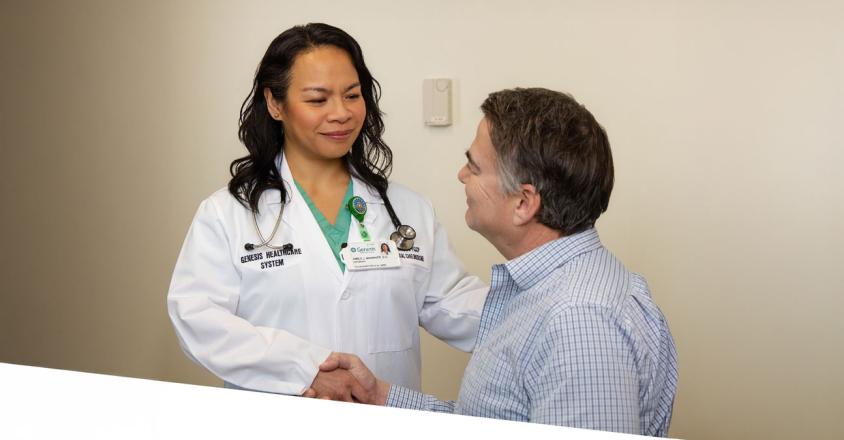 Emily J. Brawner, D.O., and patient, shaking hands