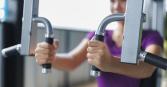 woman working out at the gym zoomed in on her arms