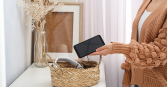 woman placing phone in basket