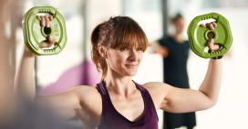 Woman working out with dumbbell weights
