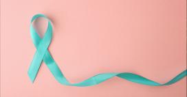 cervical cancer awareness ribbon in teal with pink backdrop
