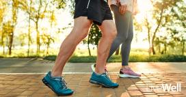 man with strong calf muscles walking outside with woman, zoomed in on their legs and shoes