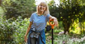 woman smiling while gardening outside 