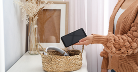 woman placing phone in basket