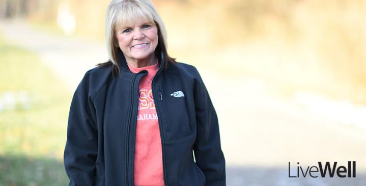 Genesis Heart and Vascular patient testimony feature image of Julie McClure, smiling outside on a sunny winter day